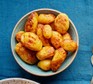 Air-fryer roast canned potatoes in a bowl