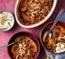Caramelised pear, rum & coconut crumble in two bowls