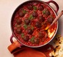Meatballs in tomato, cardamom & lime sauce served in a large casserole dish