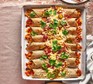 Chicken tinga-style enchiladas in a baking dish