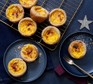 Clementine custard tarts on a cooling rack