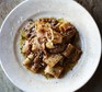 Venetian duck ragu with pasta on a white plate