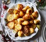 Lemon, garlic & bay roast potatoes served on a decorative plate