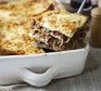 Lasagne in a dish with slice out