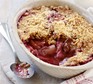 Rhubarb crumble with scoop taken out