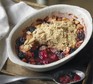 Apple & blackberry crumble in an oval dish