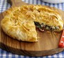 Crispy Greek-style pie filled with feta, spinach and sundried tomato