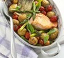 Salmon in a pot with potatoes and tomatoes