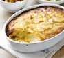 Dauphinoise potatoes in an oval dish with portion out