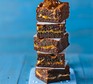 Salted caramel brownies stacked in a tower