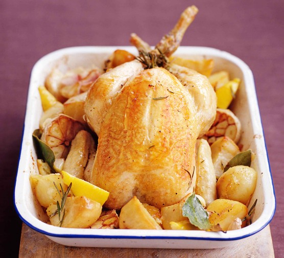 Slow roast chicken and potatoes in a baking dish