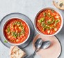 Orzo tomato soup with pesto in bowl