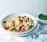 A bowl serving tuna & caper orzo with parsley