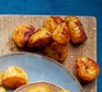 Umami roast potatoes on a wooden board