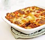 Vegetarian lasagne in a white dish with a white background